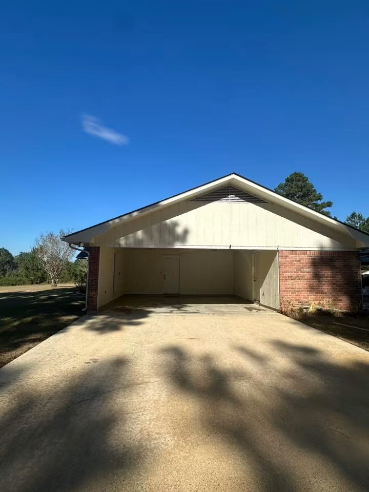 Clean driveway and carport after pressure washing